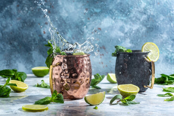 Icy cold moscow mules with ginger beer and vodka. splashes frozen motion. banner, menu, recipe, place for text