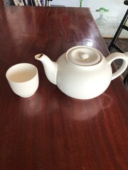 teapot and cup on a table