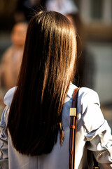 Fototapeta premium Asian girl with long hair in the background, exposed to the sun
