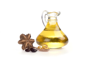 Sacha inchi seeds and oil isolated on white background.