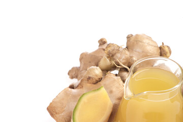 Ginger root or zingiber officinale and oil isolated on white background.