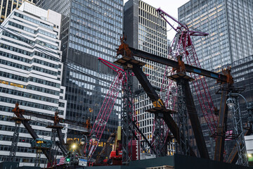 Construction site with many cranes, modern business building foundation. Manhattan, New York City street photography