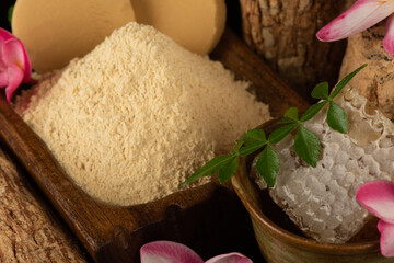 Still life with thanaka honey and lemon on an old wood background.