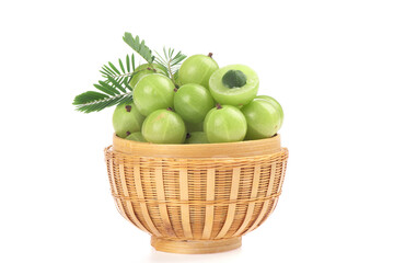 Indian Gooseberry or Phyllanthus emblica  fruits and green leaves isolated on white background.