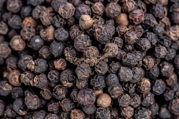 Top view black pepper seeds background.