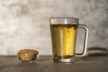 Hot healthy tea with fresh birch buds in spring, close up