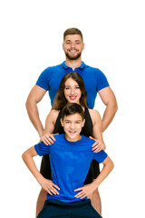 Portrait of sporty healthy parents doing fitness exercise with son