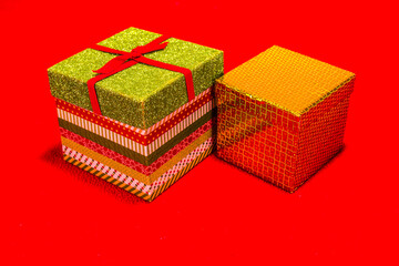 Two Decorative Christmas Gift Boxes On  Red Background