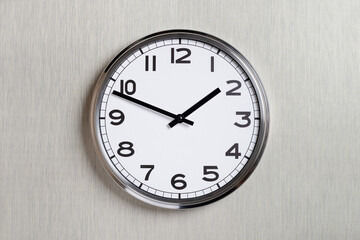 Fototapeta na wymiar Plain wall clock in the center of grey textured background. Two o'clock. Close up banner with copy space, time management or business concept and lunch time. Opening or closing hours. Schedule