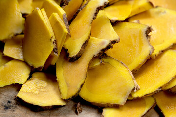 Zingiber montanum or phlai rhizome slices on nature background.