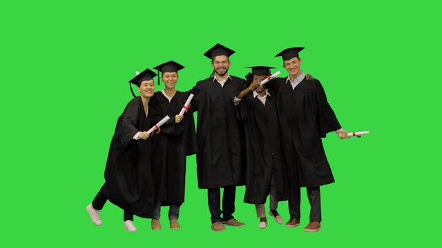 Students taking a group picture at their graduation party on a Green Screen, Chroma Key.