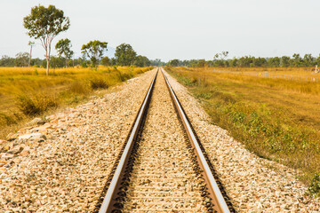 Fototapeta premium The railroad tracks in the Queensland Outback lead straight to nowhere