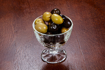 Green and black olives in the bowl
