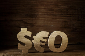 Seo -  wooden word made from  dollar and euro sign.
