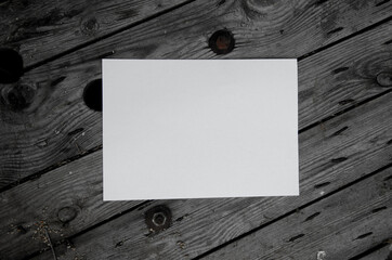 White sheet on a gray wooden background.