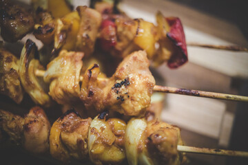 Close up image of traditional chicken kebabs or sosaties that was cooked on a braai in south africa