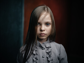vintage portrait of a girl in a dress on a dark background beautiful face cropped view