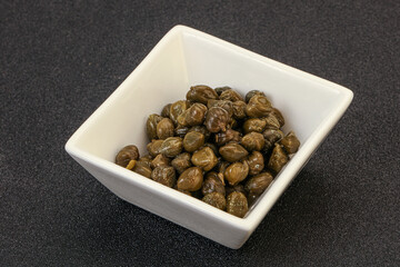 Tasty capers in the bowl