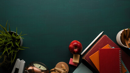 School elements, top view of study table with books, stationery, supplies, decorations and copy space