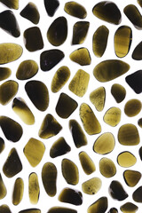 Gold obsidian jewel texture on light surface background. Sparse mineral pebbles creative.