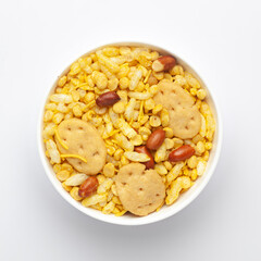 Close up of Bhel puri Indian namkeen (snacks) on a ceramic white bowl. Top view