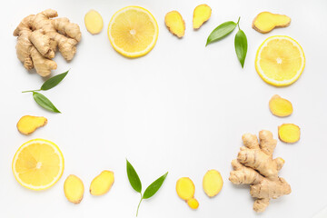 Frame made of fresh ginger and lemon on white background