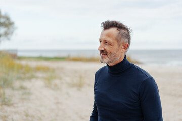 Close up profile portrait of a thoughtful middle-aged man