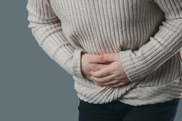 Studio portrait of child with stomach pain.