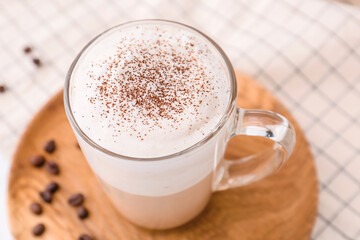 Glass cup of tasty latte, closeup