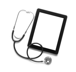 Stethoscope and tablet computer on white background