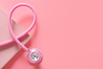 Stethoscope and notebook on color background