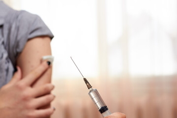 An orderly inoculates a vaccine against viruses. fighting the epidemic vaccination.