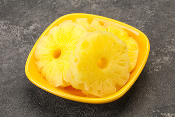 Sweet pineapple rings in the bowl