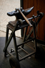 Blacksmith tools. Anvil and sledgehammer in the stable