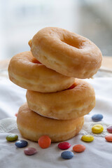 group of donuts with candies on the table