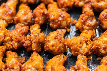 Close up of Fried Chicken Drumstick with garlic and pepper, thai street food market
