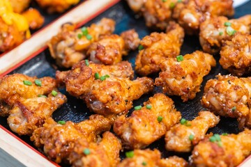Close up of Fried Chicken Drumstick with garlic and pepper, thai street food market