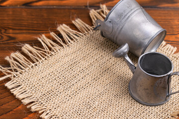 mini watering can and bucket are on the table