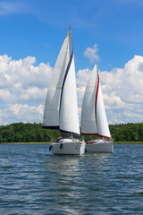 Lake in Polish Masuria, sailing yachts on a sunny day, Masuria, Poland - obrazy, fototapety, plakaty