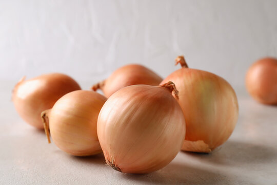 Fresh Ripe Onion On White Textured Background