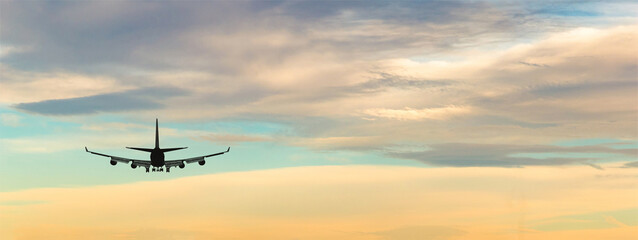 Airplane take off on a sunset.
