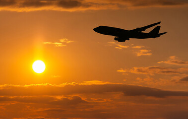 Airplane take off on a sunset.
