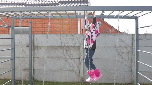 Child playing on monkey bars