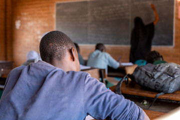 Boy attending class in a school in a rural The Gambia - obrazy, fototapety, plakaty