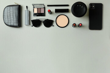 Fototapeta na wymiar Beauty concept with makeup cosmetics on gray background