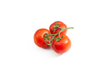 Three ripe tomatoes on the vine isolated on a white background. Tomato with clipping path. Full depth of field. Close up.