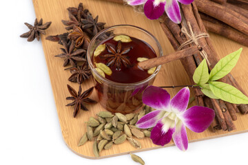 Green cardamom ,siam cardamom,star anise ,cinnamon bark and tea isolated on white background.