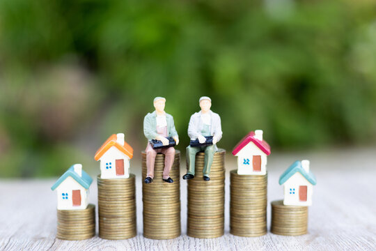 The house on the ladder A model businessman on a pile of coins Business Startup Ideas Mortgage and Real Estate Investing Money Savings Investing Risks.