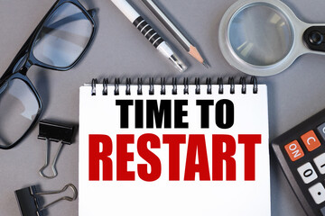 time to restart. text on white paper on gray background