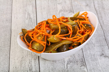 Pickled cucumbers with carrot and herbs
